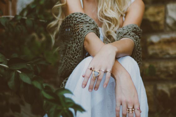 Woman Sitting with Arms Crossed